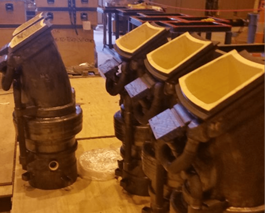 New Manufacturing 1 A couple of pipes that are sitting in the floor
