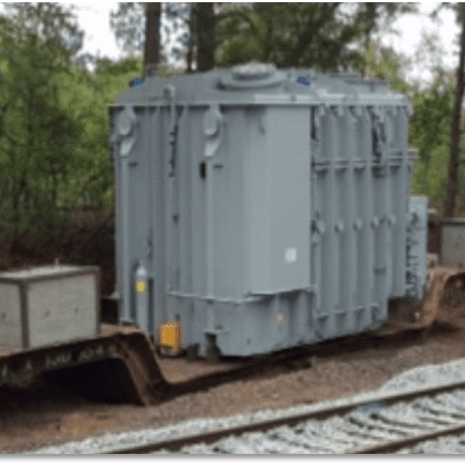 250mvartransformer A train car sitting on top of the tracks.